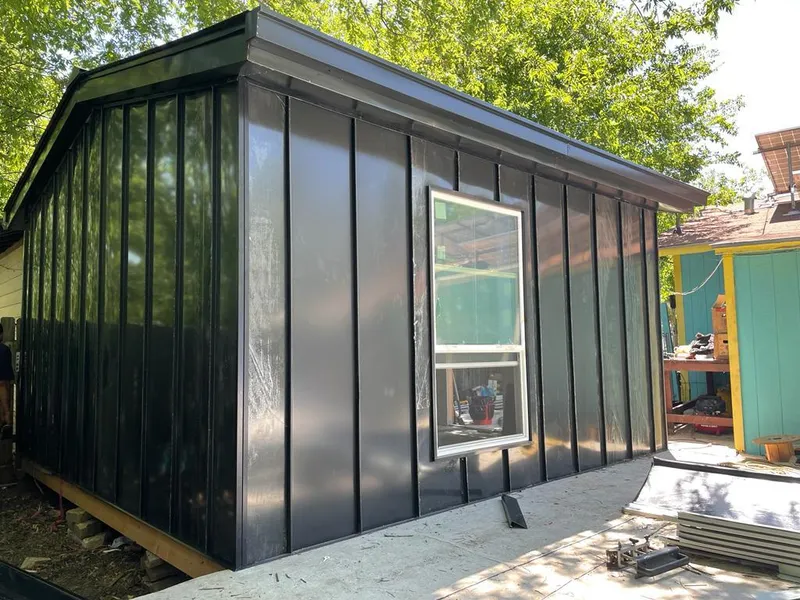 Black standing seam metal wall panels for Roof Inspection in Mayville