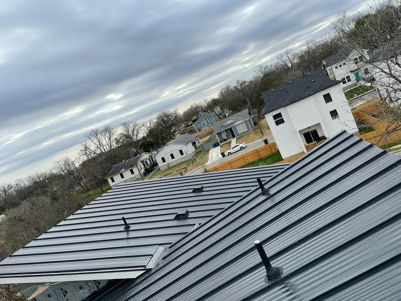 Standing seam metal roof panels with vents for Skylight Repair in Mayville